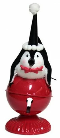Melrose 10.5" Playful Glittered Black And White Penquin Laying On Large Red Jingle Bell Christmas Table Top Decoration